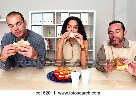 Stock Image - Having the lunch break. Fotosearch