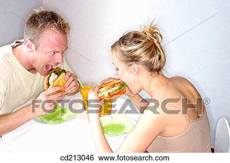 Stock Photograph - Hungry couple. Fotosearch