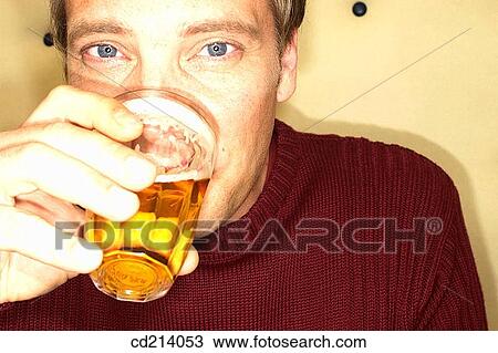 Man drinking beer, close-up View Large Photo Image Stock Image - Man drinking beer, close-up. Fotosearch