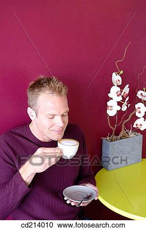 Stock Image - Man drinking coffee. Fotosearch