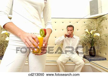 Man drinking coke, medium-shot woman View Large Photo Image Stock Image - Man drinking coke, medium-shot woman. Fotosearch
