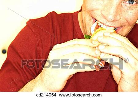 Man eating sandwich View Large Photo Image Picture - Man eating sandwich. Fotosearch