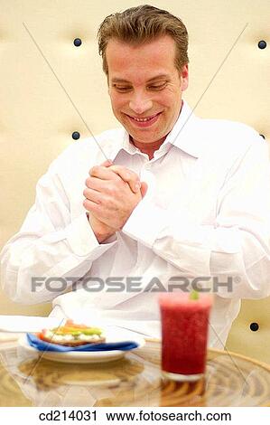 Stock Image - Man getting ready to eat. Fotosearch