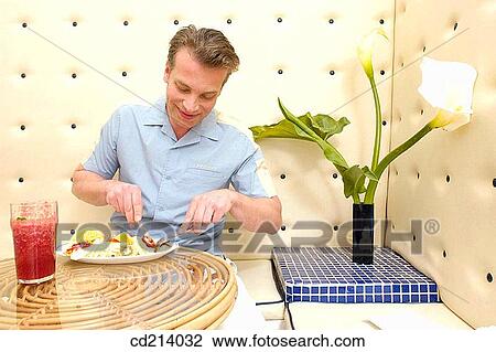 Man having breakfast View Large Photo Image Stock Image - Man having breakfast. Fotosearch