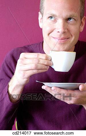 Man having coffee View Large Photo Image Stock Photo - Man having coffee. Fotosearch