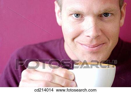 Man holding coffee-cup View Large Photo Image Picture - Man holding coffee-cup. Fotosearch