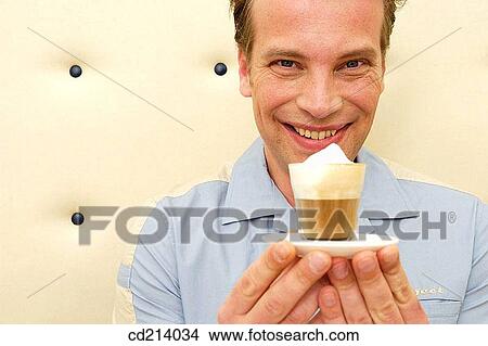 Man holding coffee View Large Photo Image Picture - Man holding coffee. Fotosearch