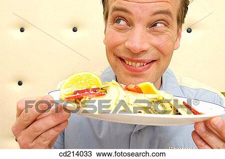 Man holding fruits plate View Large Photo Image Stock Image - Man holding fruits plate. Fotosearch