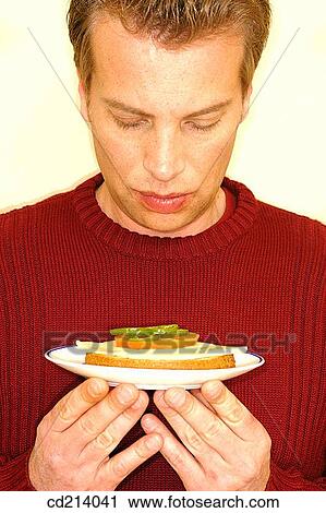 Man holding plate with toast View Large Photo Image Stock Image - Man holding plate with toast. Fotosearch