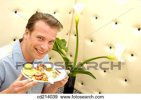 Man in bar having breakfast View Large Photo Image Stock Photo - Man in bar having breakfast. Fotosearch