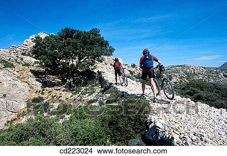 Mountain bikers, Caragoli, Valldemossa, Serra de Tramuntana, Mallorca, Spain View Large Photo Image Picture - Mountain bikers, Caragoli, Valldemossa, Serra de Tramuntana, Mallorca, Spain. Fotosearch