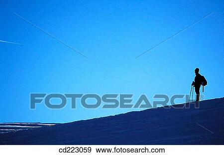 Outline of an hiker during a snowshoe tour above Lake Walchensee, Upper Bavaria, Alps, Germany View Large Photo Image Stock Photo - Outline of an hiker during a snowshoe tour above Lake Walchensee, Upper Bavaria, Alps, Germany. Fotosearch