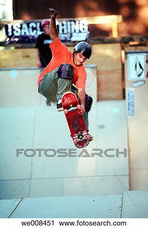 Skateboarder doing a jump View Large Photo Image Stock Image - Skateboarder doing a jump. Fotosearch