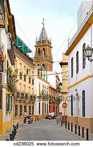 Street scene in Barrio de Triana with Santa Ana church. Seville. Andalusia, Spain View Large Photo Image Stock Photography - Street scene in Barrio de Triana with Santa Ana church. Seville. Andalusia, Spain. Fotosearch