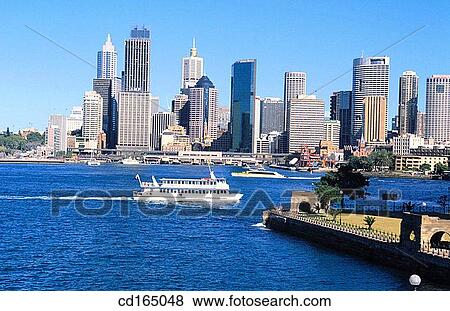 Tourist cruiser passing Central Business District, Sydney, Australia View Large Photo Image Stock Photo - Tourist cruiser passing Central Business District, Sydney, Australia. Fotosearch