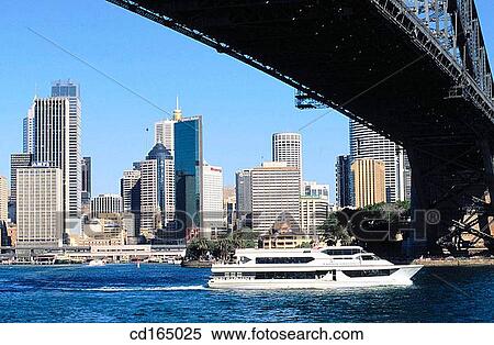 Tourist cruiser passing under Harbour Bridge. Sydney. Australia View Large Photo Image Stock Photography - Tourist cruiser passing under Harbour Bridge. Sydney. Australia. Fotosearch