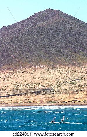 Windsurfing. El Medano. Tenerife. Canary Islands. Spain View Large Photo Image Stock Image - Windsurfing. El Medano. Tenerife. Canary Islands. Spain. Fotosearch