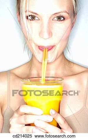 Stock Photography - Woman drinking orange juice. Fotosearch