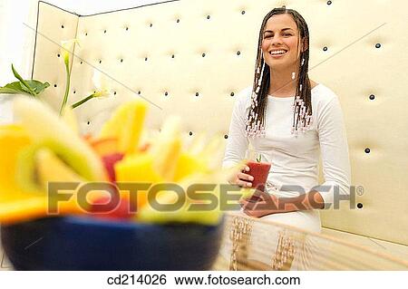 Woman drinking tomato juice View Large Photo Image Stock Photograph - Woman drinking tomato juice. Fotosearch