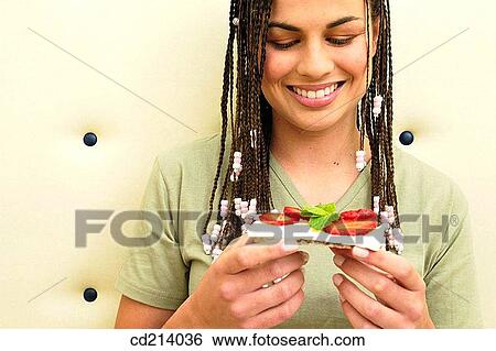 Woman eating cheese toast View Large Photo Image Stock Photograph - Woman eating cheese toast. Fotosearch