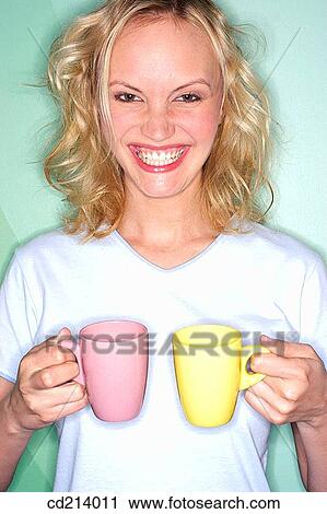Woman holding cups View Large Photo Image Stock Image - Woman holding cups. Fotosearch