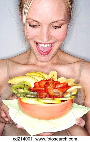 Woman with fruit salad View Large Photo Image Stock Image - Woman with fruit salad. Fotosearch