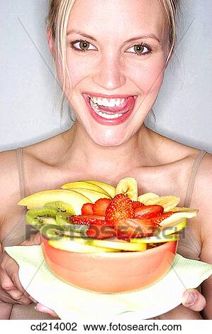 Woman with fruits salad View Large Photo Image Stock Image - Woman with fruits salad. Fotosearch