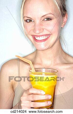 Woman with orange juice View Large Photo Image Picture - Woman with orange juice. Fotosearch