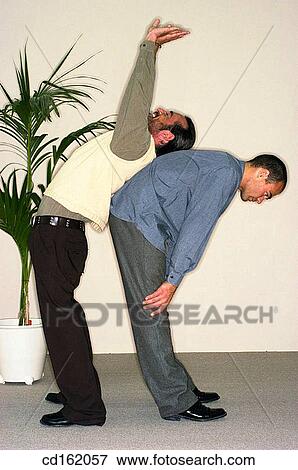 Work mates stretching View Large Photo Image Stock Photo - Work mates stretching. Fotosearch