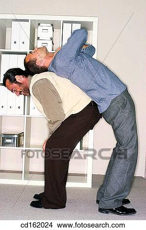 Wrok mates stretching View Large Photo Image Picture - Wrok mates stretching. Fotosearch