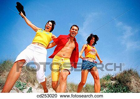 30's, beach, Arms raised, amusement, 20's View Large Photo Image Stock Image - 30's, beach, Arms raised, amusement, 20's. Fotosearch