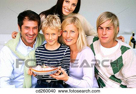 Stock Image - 30's, Birthday cake, aunt, at-home, 20's. Fotosearch