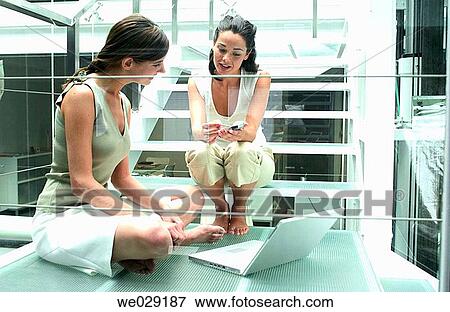 Stock Photo - 30's, business, barefoot, agenda, 20's. Fotosearch