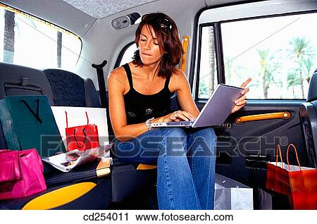 Stock Image - 30's, business, brunette, automobile, 20's. Fotosearch