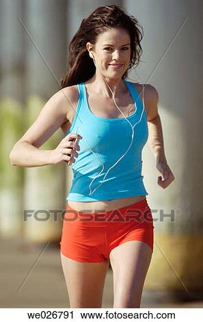A woman running on the beach. View Large Photo Image Stock Image - A woman running on the beach.. Fotosearch