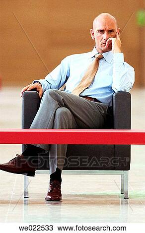 Stock Image - absorbed, boredom, bored, 30's. Fotosearch