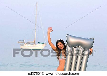air-bed, beach, Arms raised, air mattress View Large Photo Image Stock Image - air-bed, beach, Arms raised, air mattress. Fotosearch
