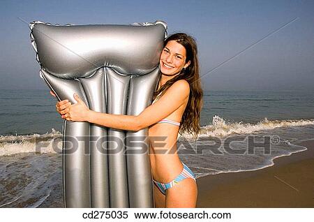 air-bed, brunette, beach, air mattress View Large Photo Image Stock Photography - air-bed, brunette, beach, air mattress. Fotosearch