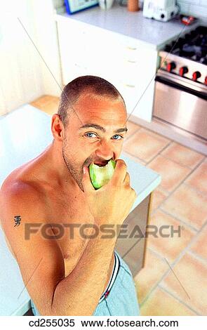 apple, biting, bite, at-home, 20's View Large Photo Image Stock Photography - apple, biting, bite, at-home, 20's. Fotosearch