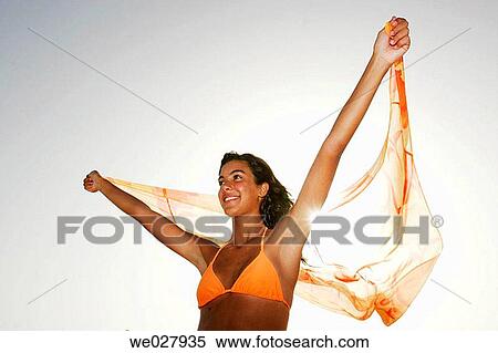 appreciative, barefoot, backlight, Arms raised, 20's View Large Photo Image Stock Photography - appreciative, barefoot, backlight, Arms raised, 20's. Fotosearch
