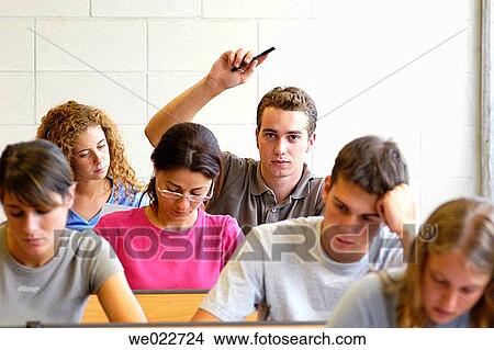 Picture - Arm raised, classroom, boy, adolescence. Fotosearch