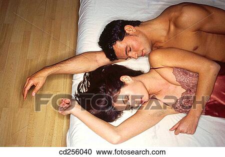 Stock Image - at-home, bonding, bond, bed, 20's. Fotosearch