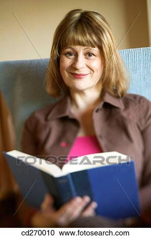Stock Image - baby boomer, book, at-home. Fotosearch