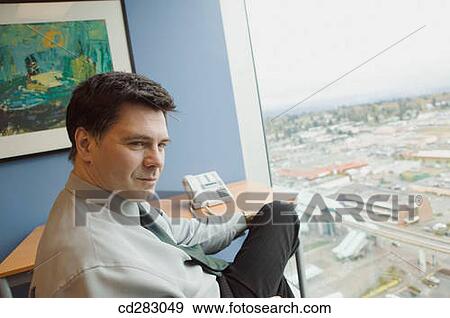 Stock Photo - baby boomer, businesspeople, businessman, business, absorbed. Fotosearch