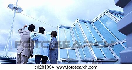 Picture - back view, businesspeople, businessman, business, antenna. Fotosearch