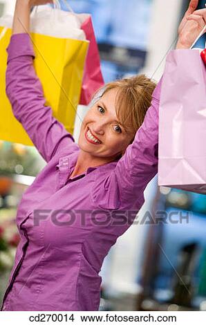 bag, consumption, Arms raised View Large Photo Image Picture - bag, consumption, Arms raised. Fotosearch