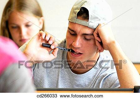 Ball-point pen, boy, biting, bite, adolescence View Large Photo Image Stock Image - Ball-point pen, boy, biting, bite, adolescence. Fotosearch