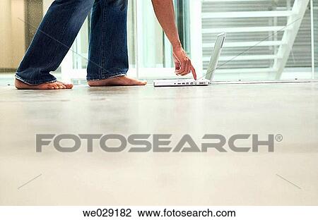 Stock Image - barefoot, businesspeople, businessman, business, anonymous. Fotosearch