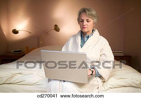 bathrobe, bedroom, bed, at-home View Large Photo Image Stock Image - bathrobe, bedroom, bed, at-home. Fotosearch