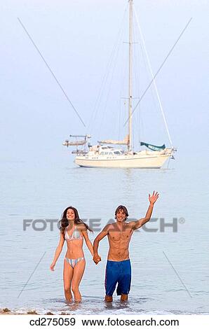 beach, brunette, Arms raised View Large Photo Image Stock Photo - beach, brunette, Arms raised. Fotosearch